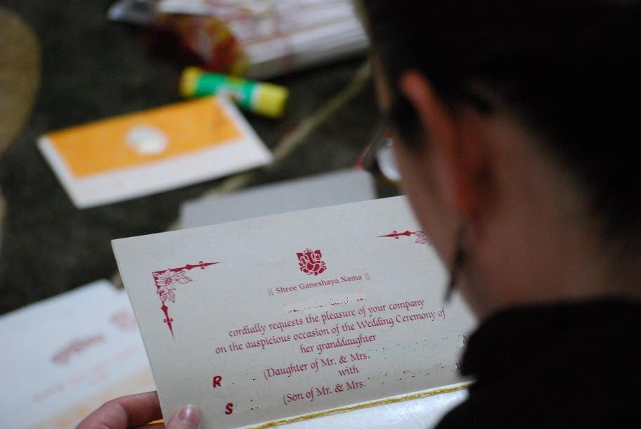 I look at R and S's wedding invitation Most were in Nepali but luckily they